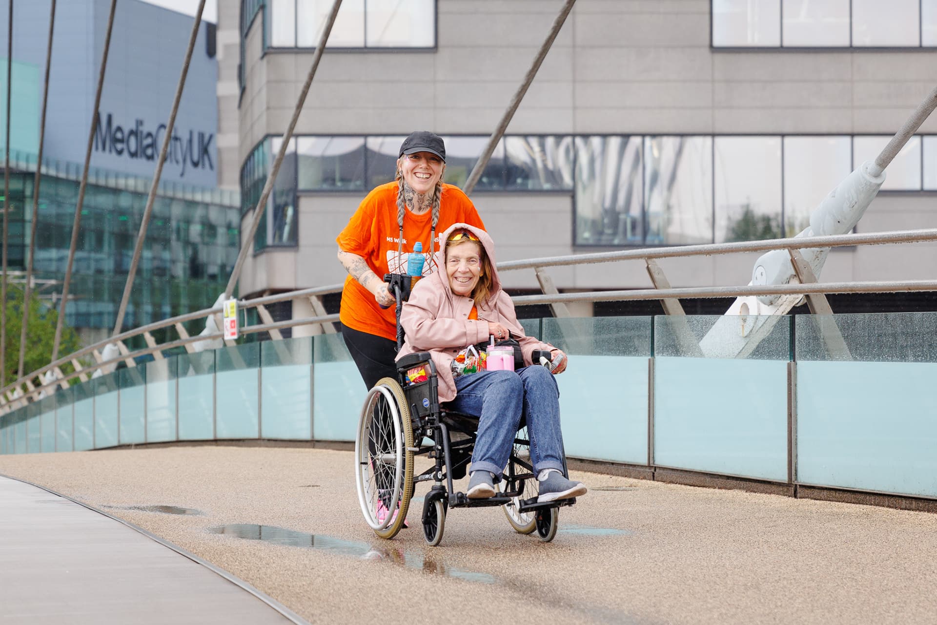 A wheelchair user and event marshal photographed outside MediaCityUK.