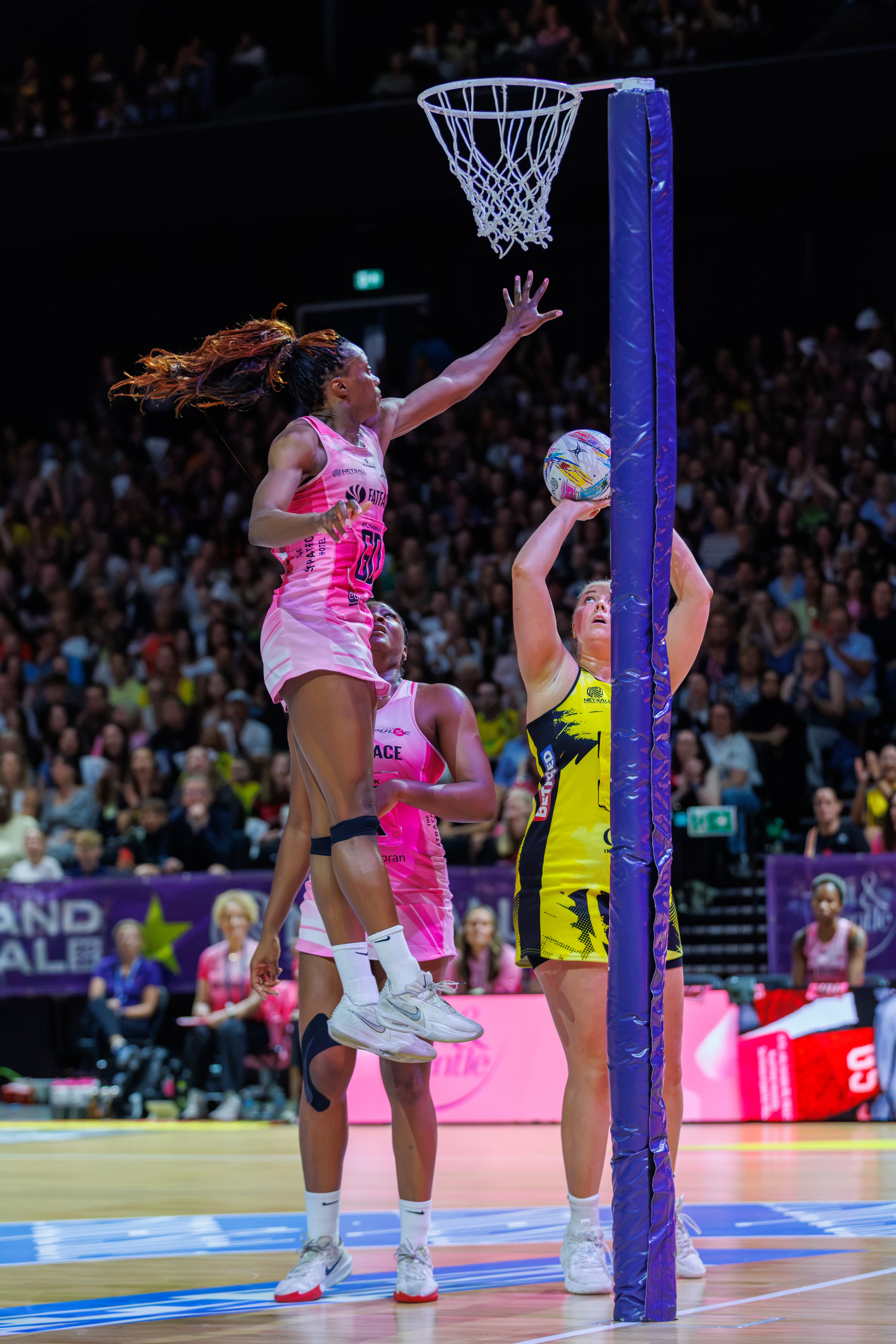 Netball player shooting from inside the goal circle during the 2026 Netball Super League Final.