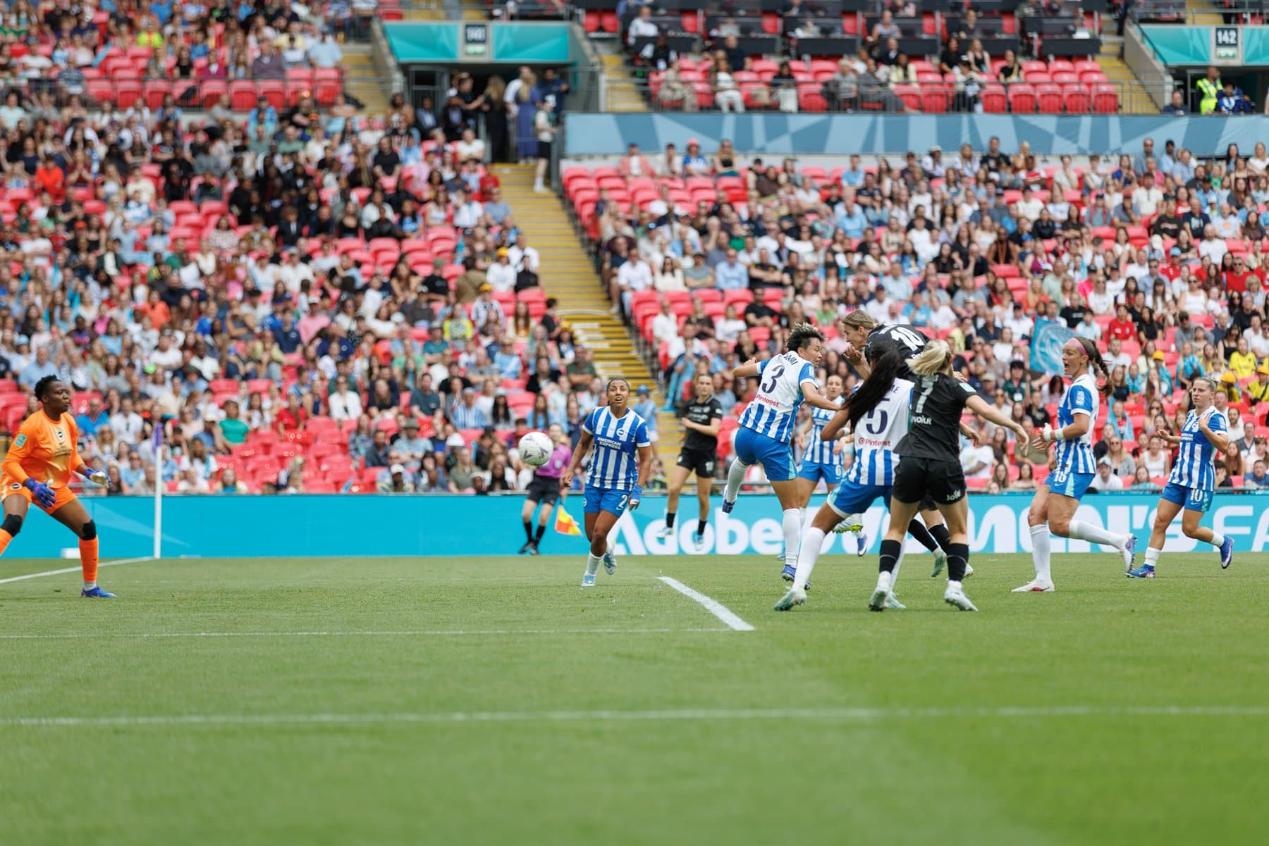 Manchester City player heads the ball towards goal during the Women's FA Cup Final at Wembley.