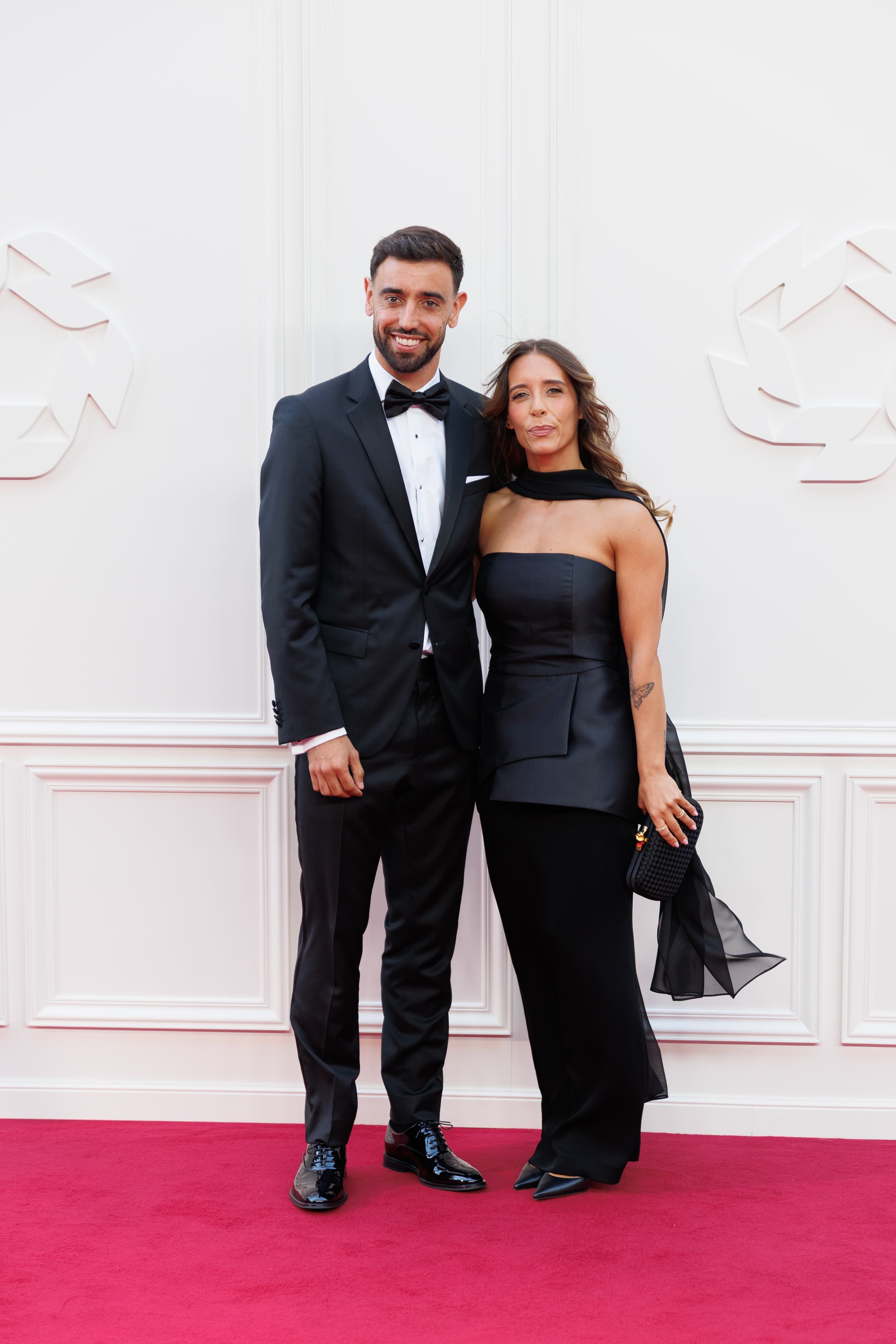 Bruno Fernandes posing with a guest on the red carpet at the 2026 PFA Awards.