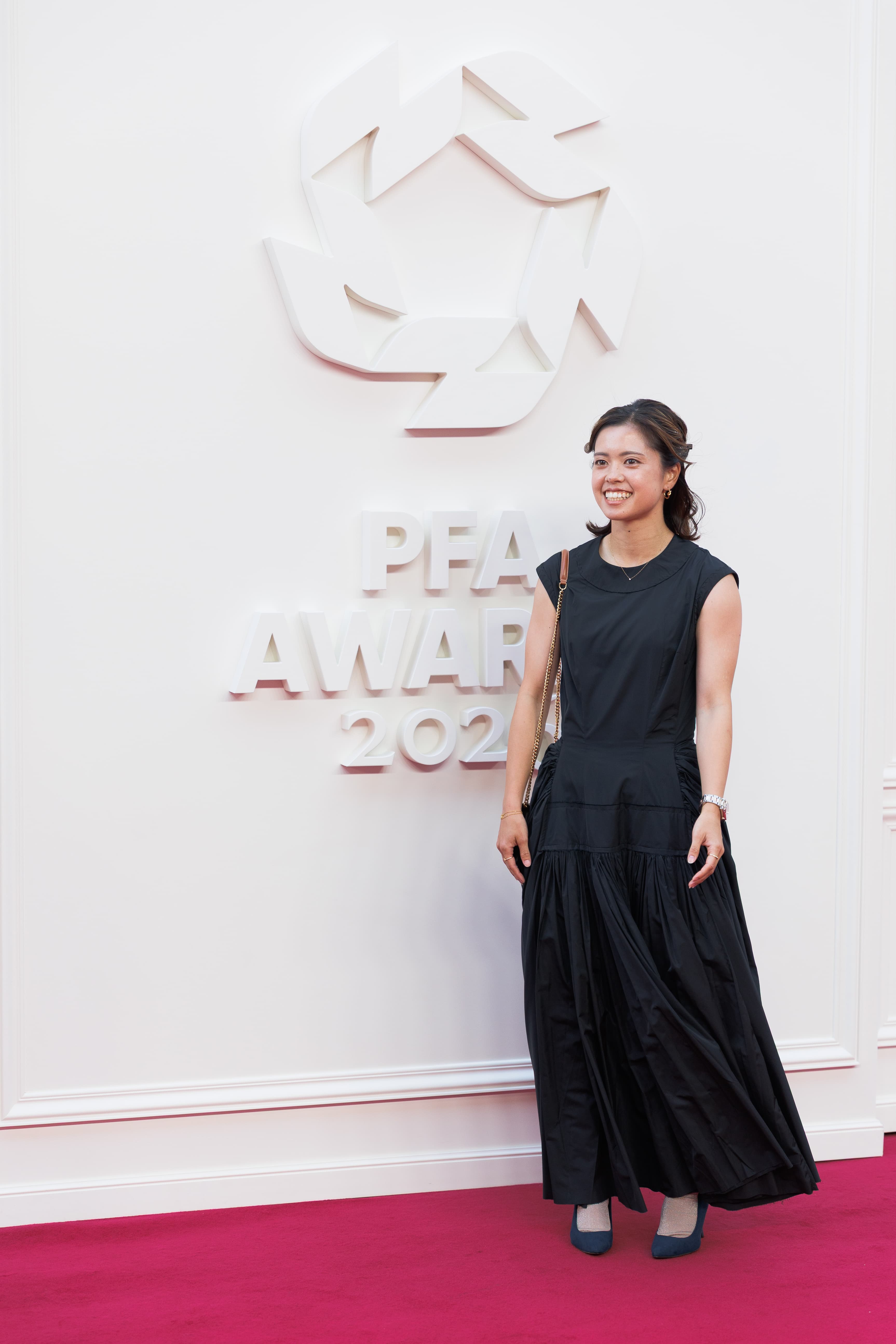 A guest photographed full length on the red carpet at the 2026 PFA Awards.