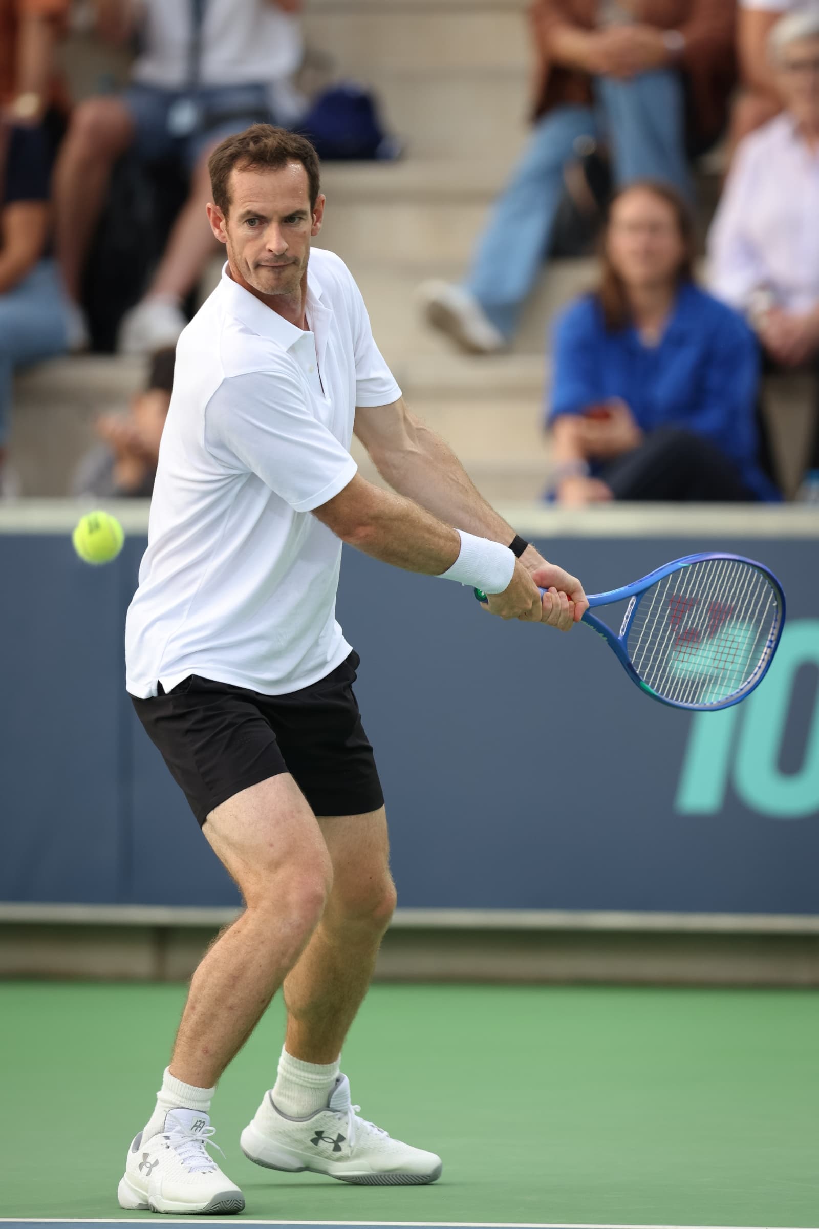 Andy Murray preparing to return a shot during the Rafa Nadal Academy Slam.