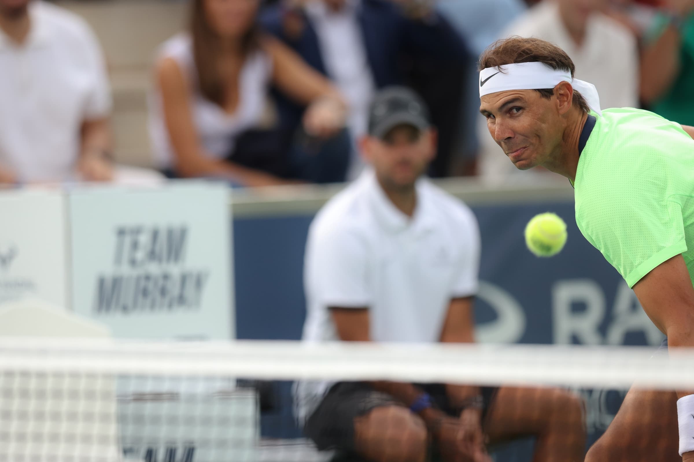 Rafael Nadal leaning into a volley during the Rafa Nadal Academy Slam.