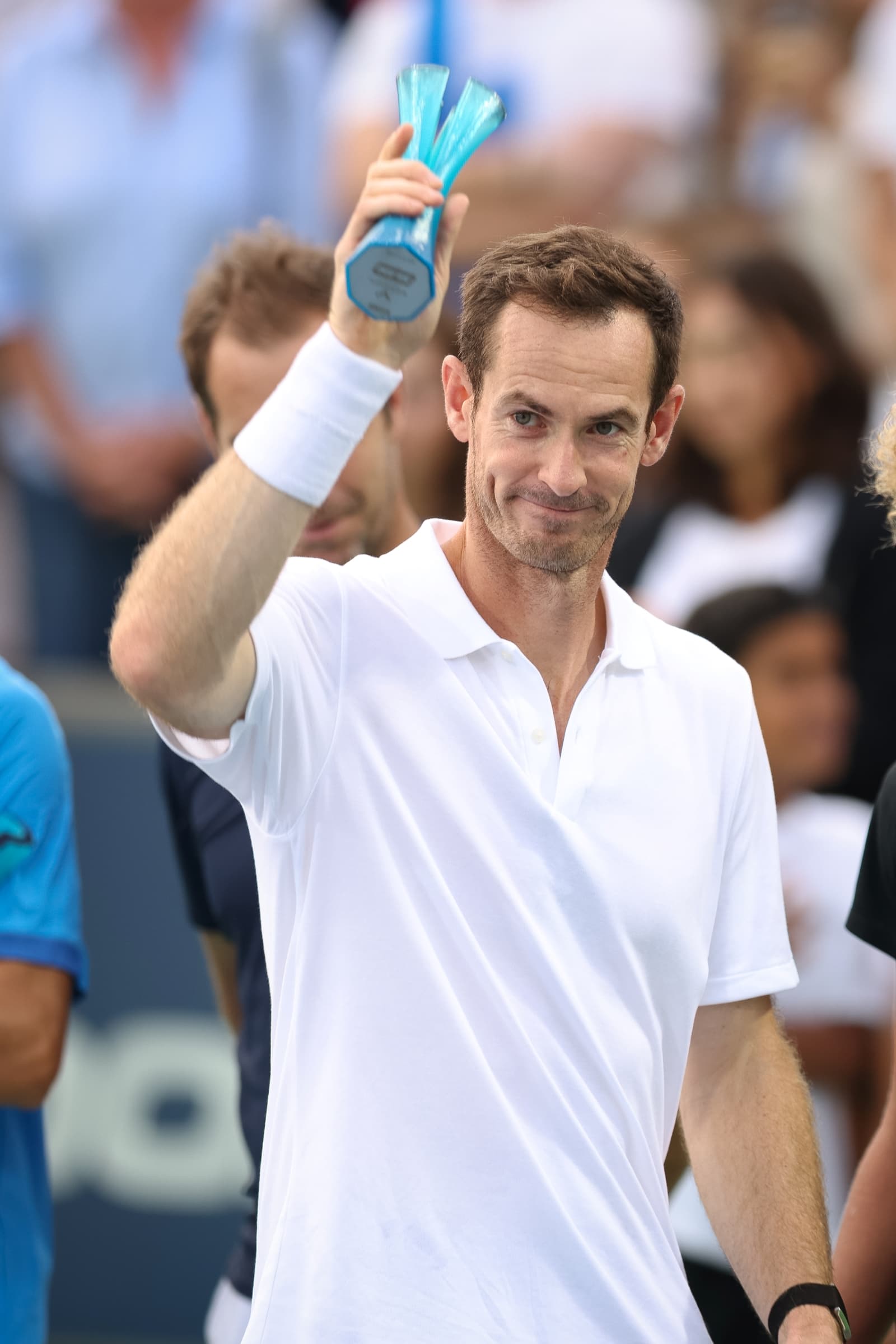 Andy Murray waving to the crowd on court during the Rafa Nadal Academy Slam.